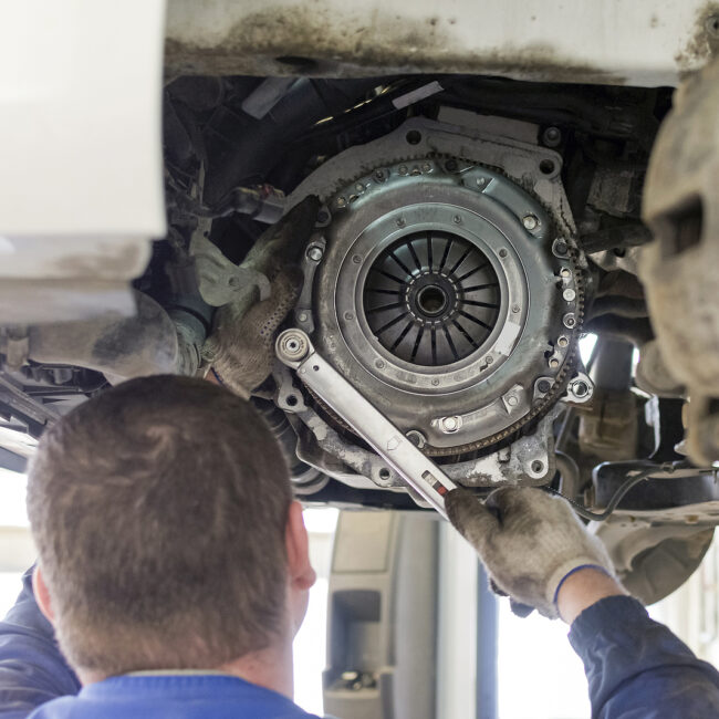 Car Repair In A Car Service. Replacing The Clutch Disc Of A Gear