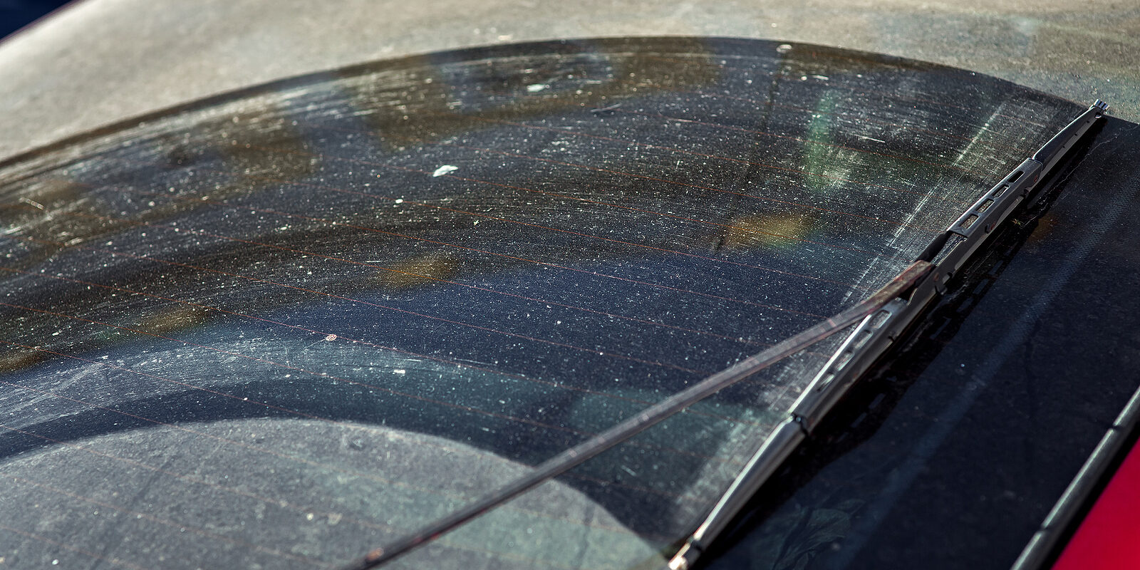 Dirty Car Window Rear View In The Back Of Hatchback On Dust And