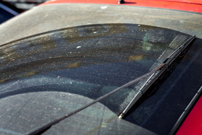Dirty Car Window Rear View In The Back Of Hatchback On Dust And