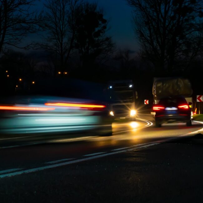Lights Of Moving Cars At Night. Long Exposure