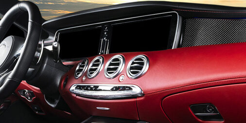 Red Luxury Modern Car Interior. Steering Wheel And Dashboard. De