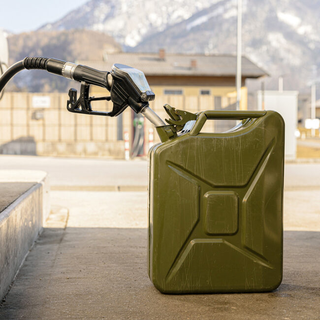 Refilling Canister With Fuel On The Petrol Station. Close Up Vie