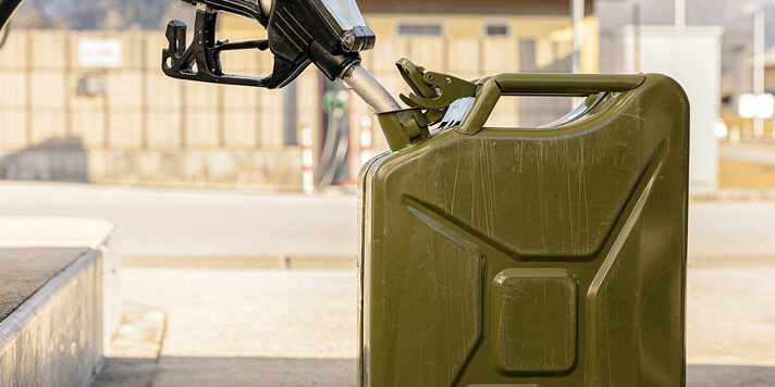 Refilling Canister With Fuel On The Petrol Station. Close Up Vie