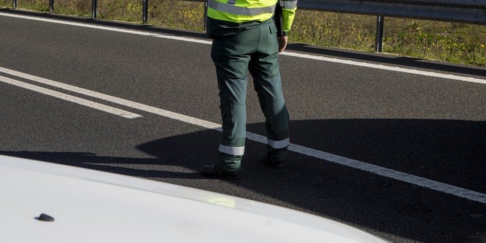 Civil Guard Traffic Of Spain With His Car On A Road
